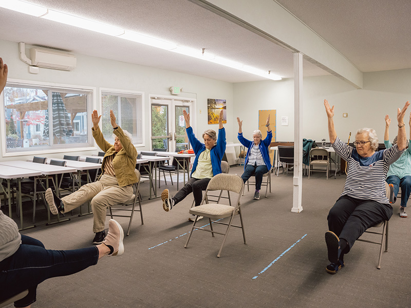 room full of seniors exercising