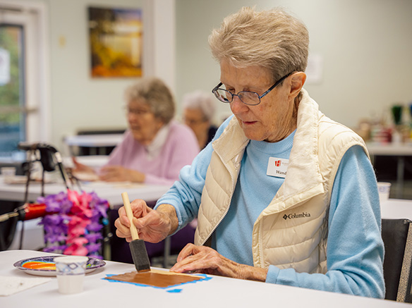 senior woman creating craft project